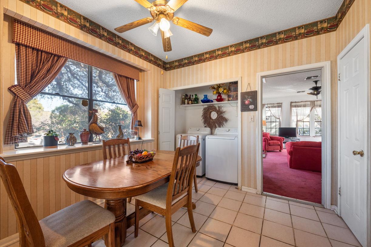 Dated kitchen with wallpaper